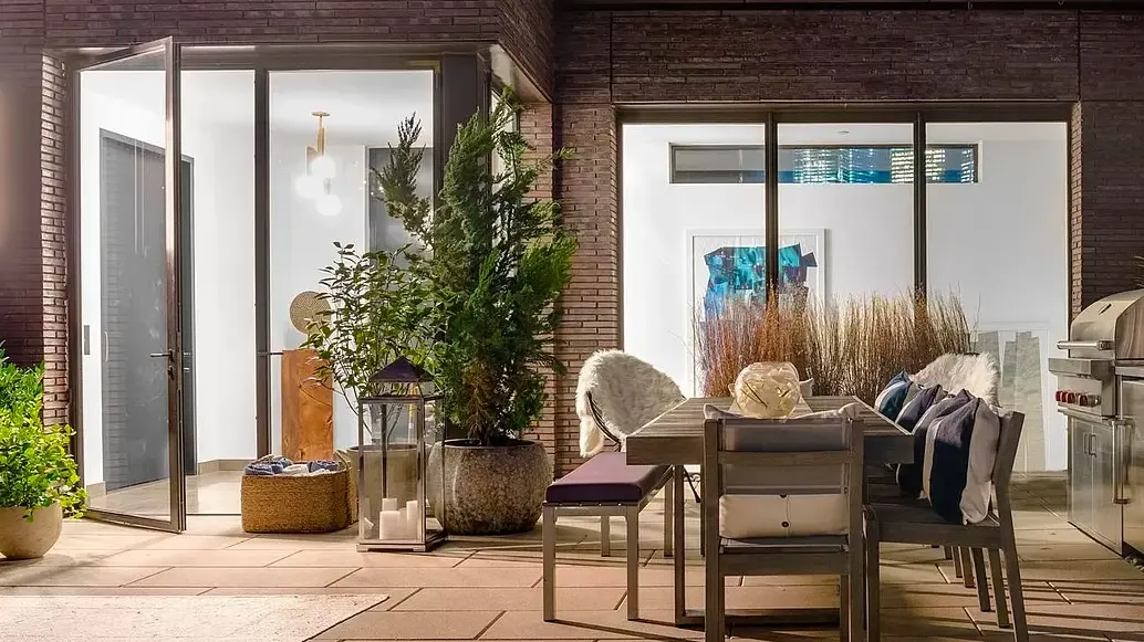 13.	Thermal Bronze French swing door pair and Fixed window wall with patina finish, low profile threshold, high performance low iron insulating glass