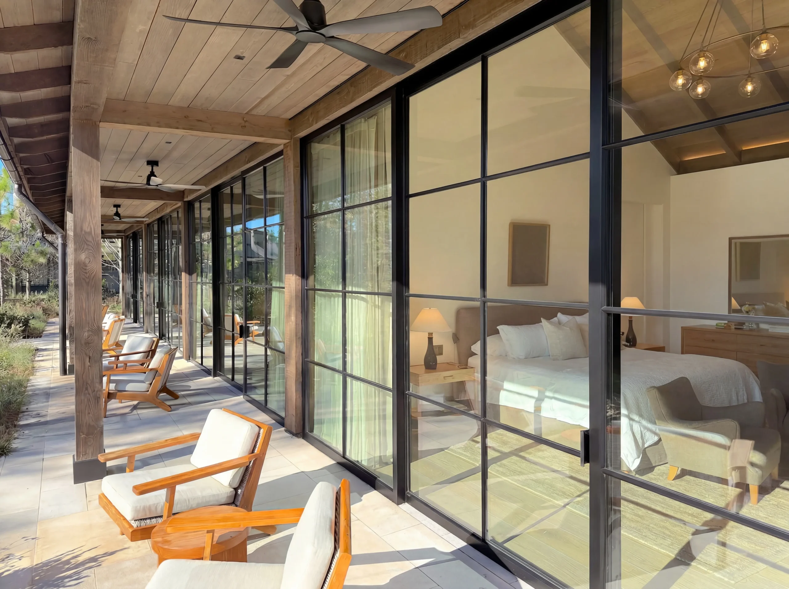 31.	Thermal Steel sliding doors with powder coat finish, SDL muntins, low profile bottom track, high performance low iron insulating glass